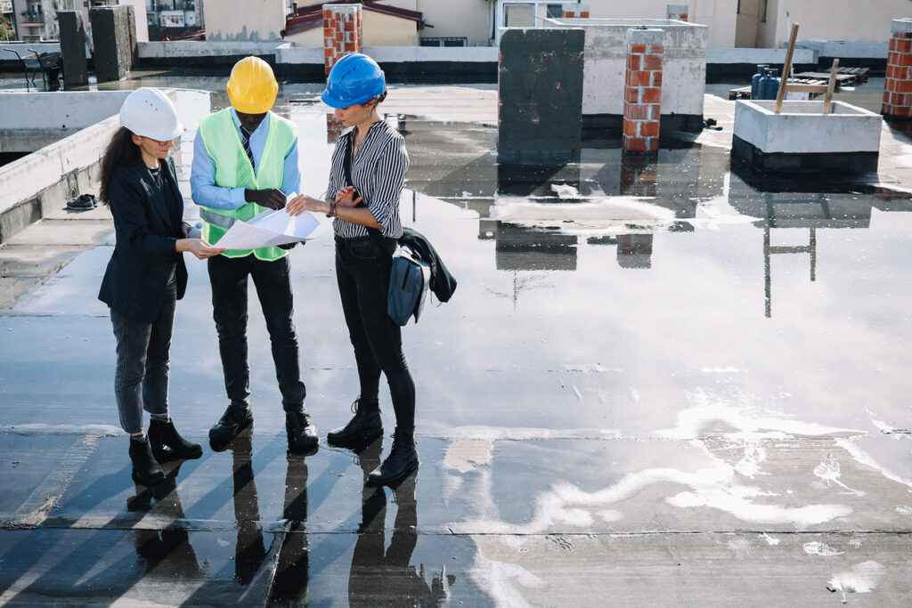 Construction team reviewing project plans.